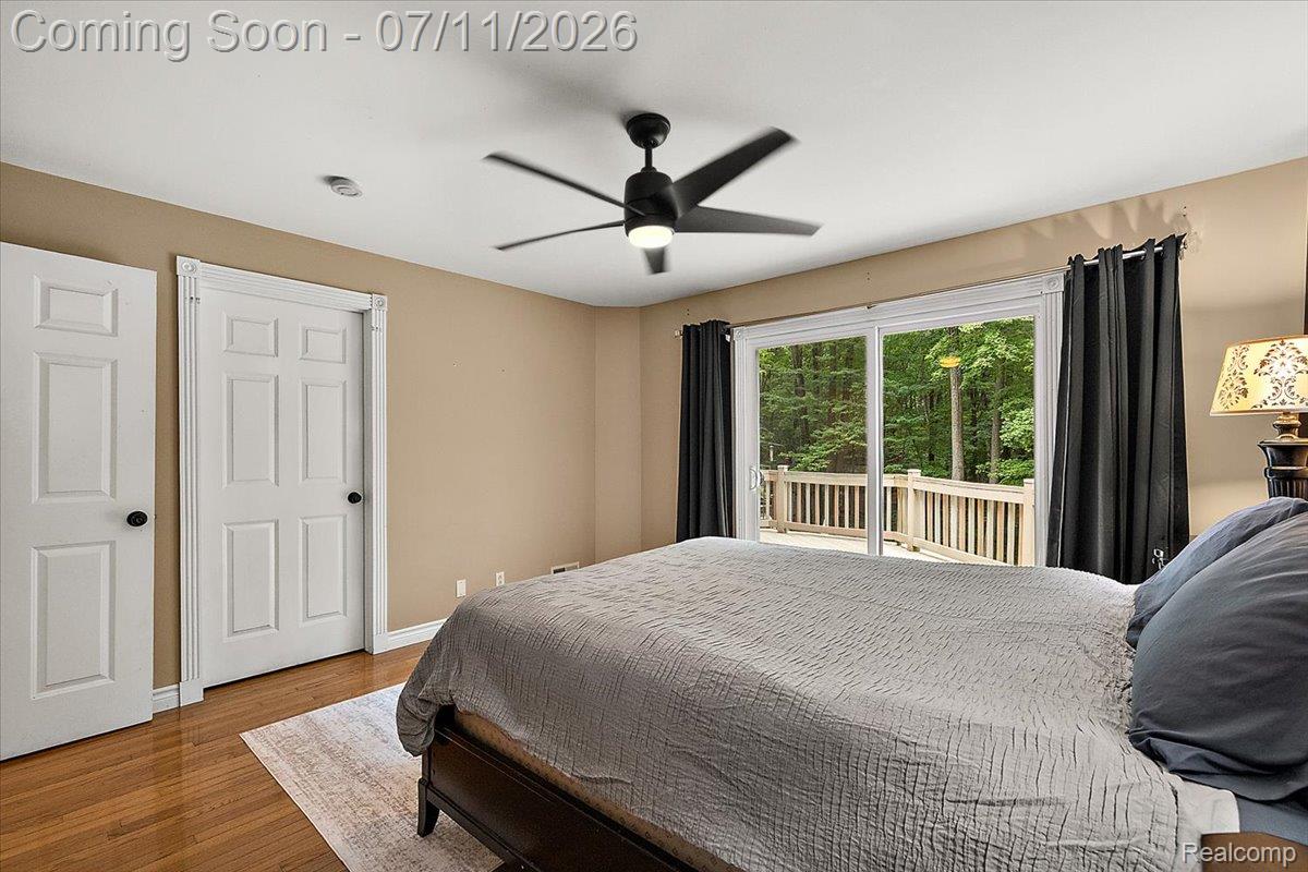 4219 Gardner Road Metamora, MI 48455 - Photo 37 of 87 Sliding glass door opening to an outdoor deck with wood railings