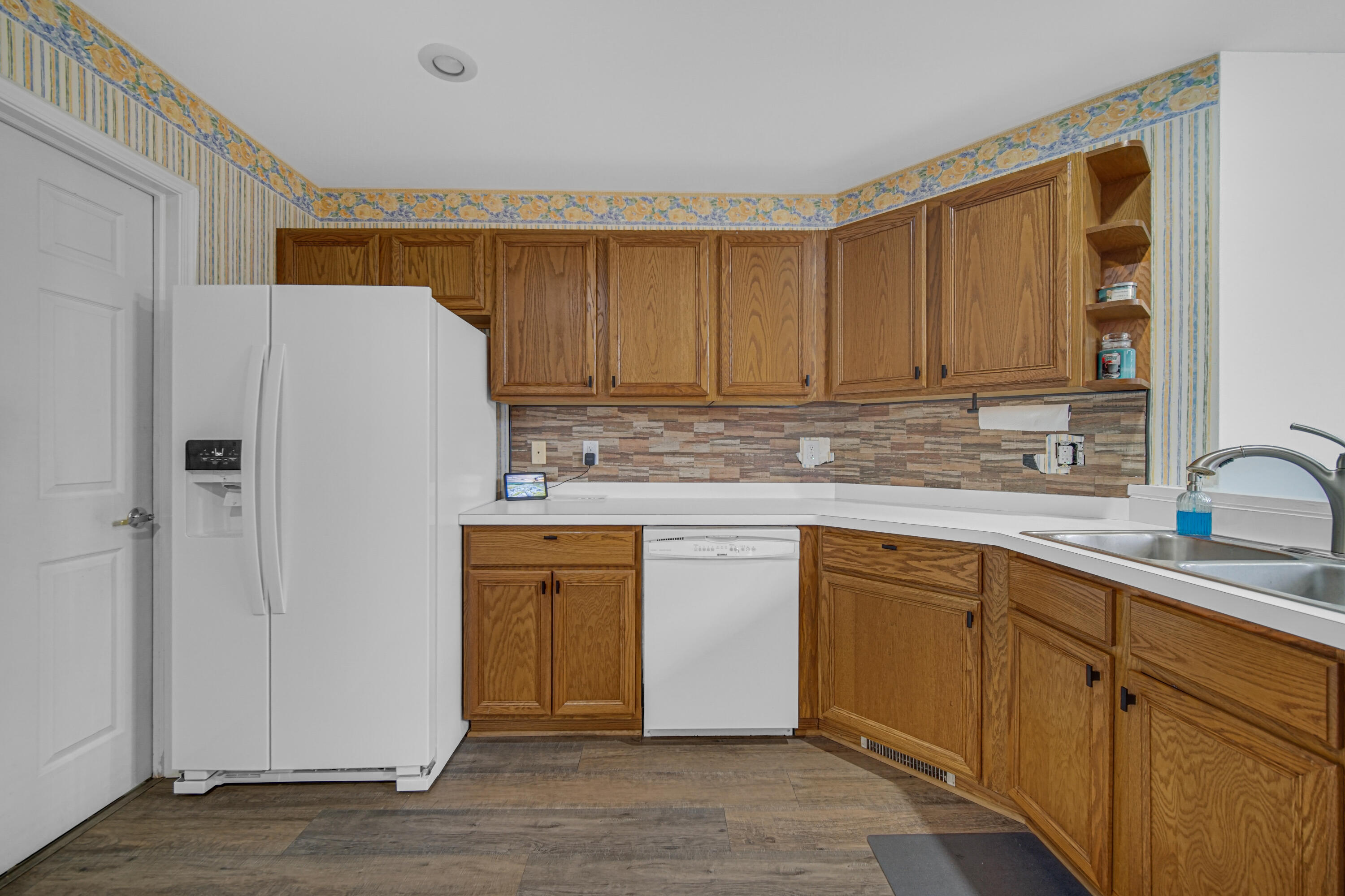 11130 Allendale Court Crown Point, IN 46307 - Photo 5 of 21 a kitchen with stainless steel appliances granite countertop a refrigerator and a sink