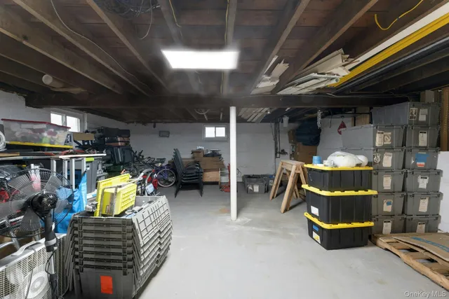 a room with lots of furniture and a chandelier