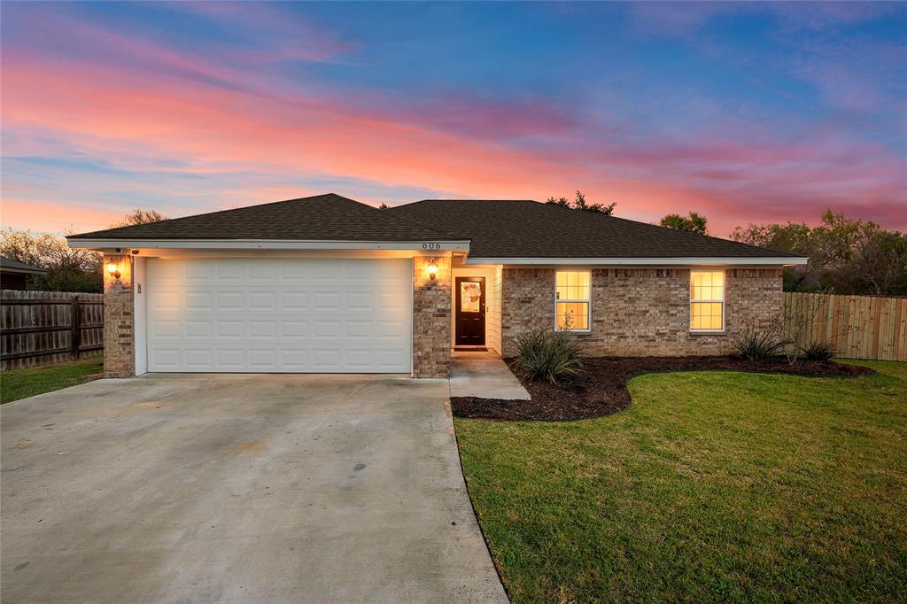 606 Powers Street Lacy-Lakeview, TX 76705 - Photo 1 of 23 a front view of a house with garden