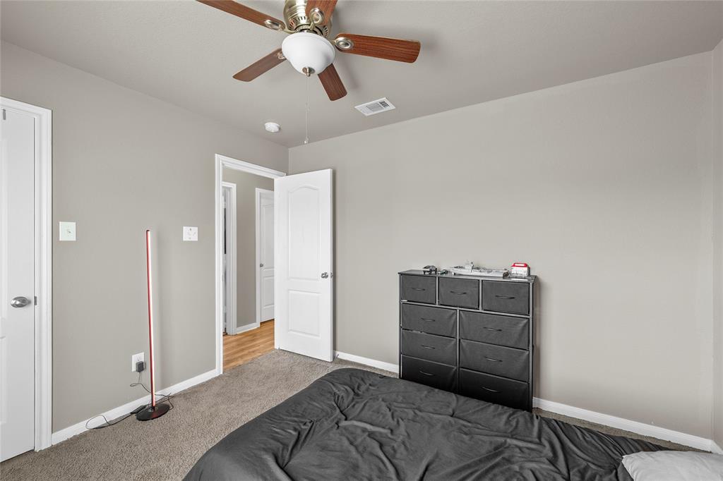 606 Powers Street Lacy-Lakeview, TX 76705 - Photo 12 of 23 a bedroom with a bed and cabinets