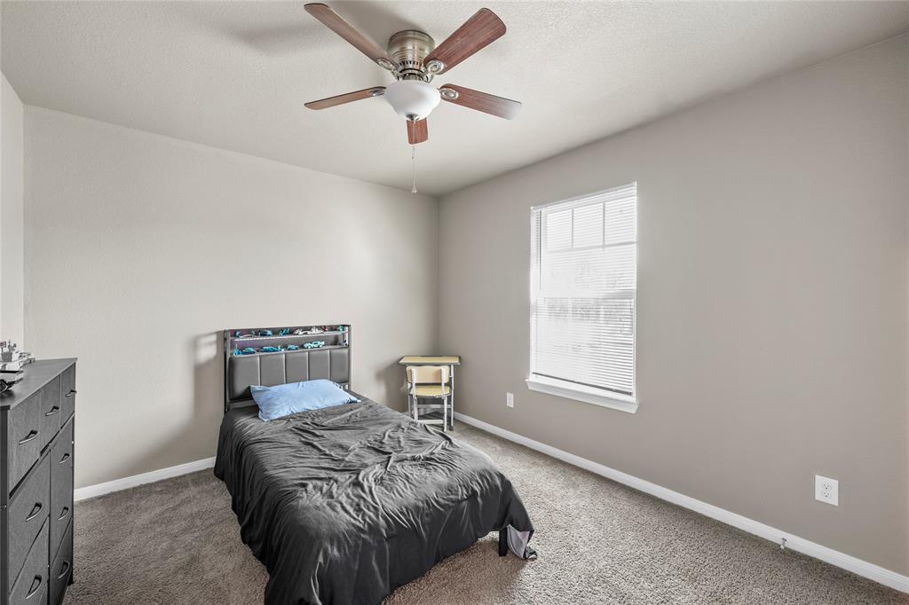 606 Powers Street Lacy-Lakeview, TX 76705 - Photo 13 of 23 a bed room with a bed and a window