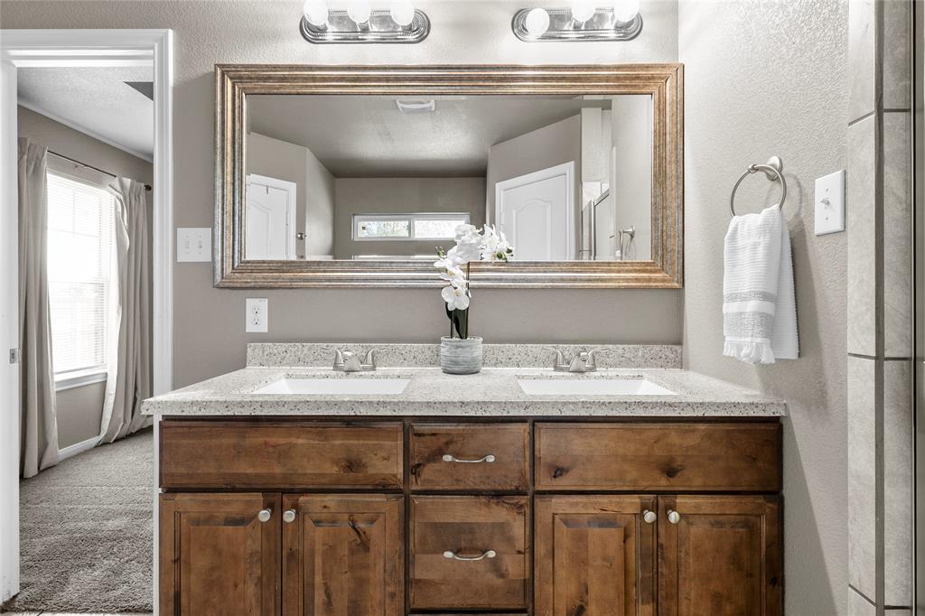 606 Powers Street Lacy-Lakeview, TX 76705 - Photo 14 of 23 a bathroom with a sink and a mirror