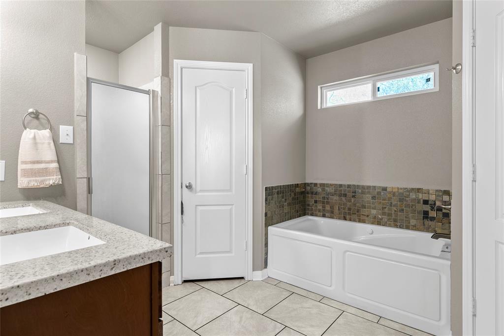 606 Powers Street Lacy-Lakeview, TX 76705 - Photo 15 of 23 a bathroom with a granite countertop sink and a mirror