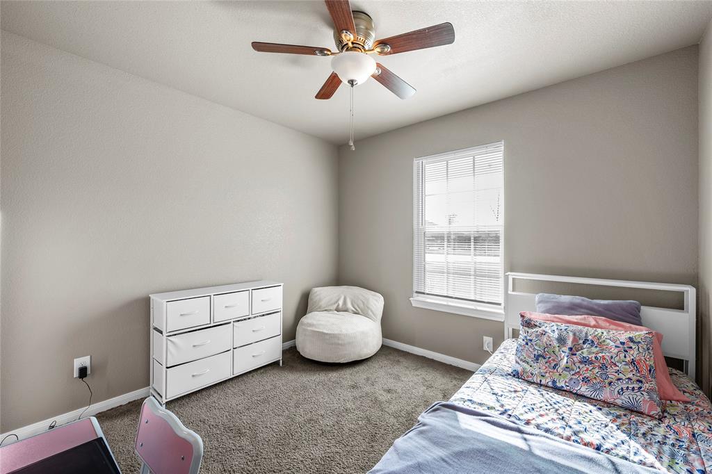 606 Powers Street Lacy-Lakeview, TX 76705 - Photo 19 of 23 a bedroom with a bed and a window