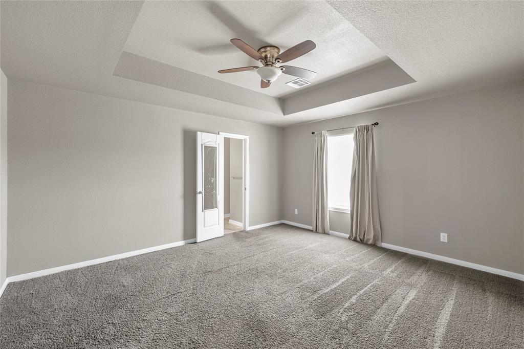 606 Powers Street Lacy-Lakeview, TX 76705 - Photo 20 of 23 a view of an empty room with a ceiling fan