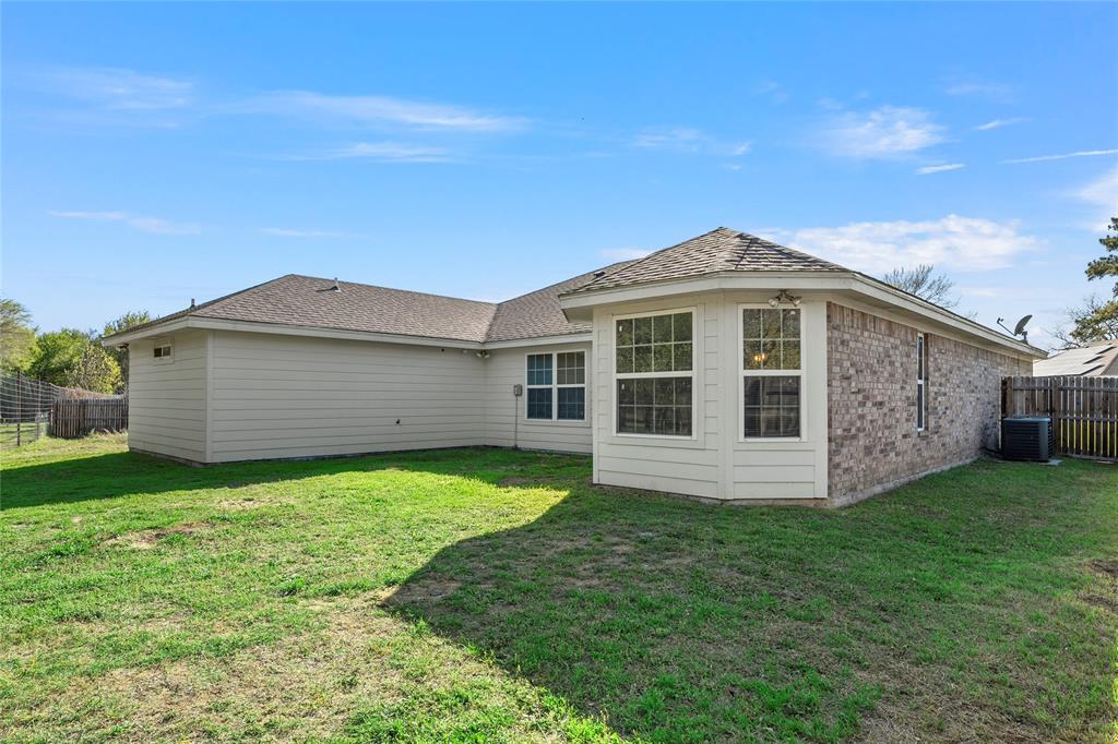 606 Powers Street Lacy-Lakeview, TX 76705 - Photo 21 of 23 a front view of a house with garden