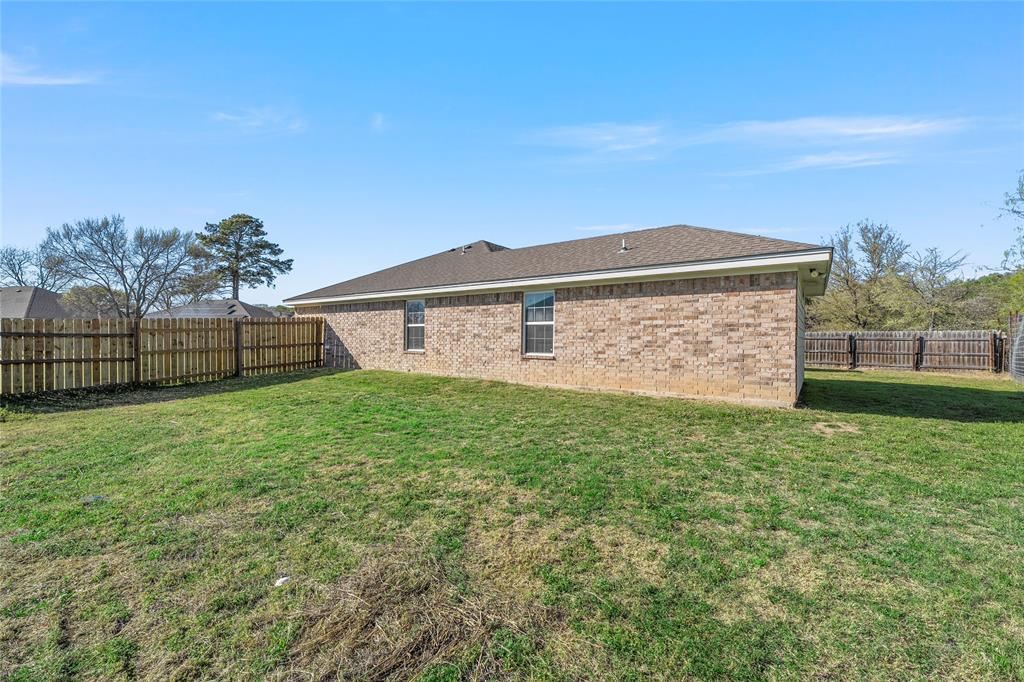 606 Powers Street Lacy-Lakeview, TX 76705 - Photo 23 of 23 a view of a backyard with a garden