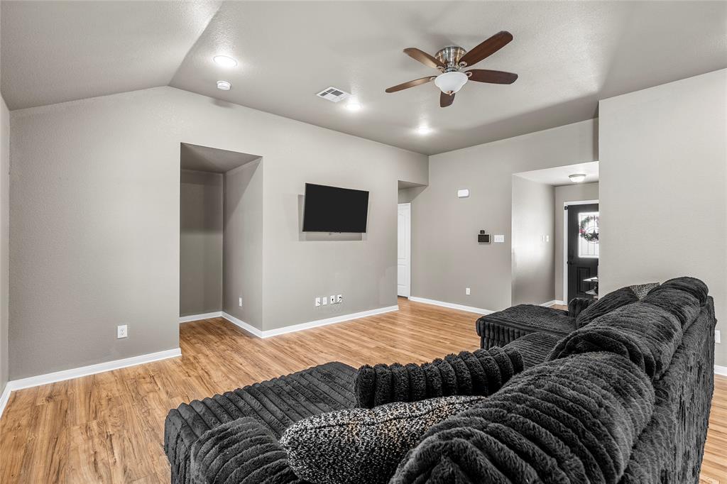 606 Powers Street Lacy-Lakeview, TX 76705 - Photo 3 of 23 a bedroom with a bed and a ceiling fan