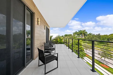 a view of balcony with furniture