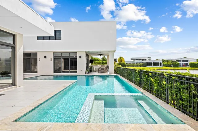 a view of swimming pool with a balcony
