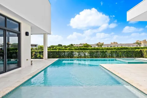 a view of swimming pool with a yard