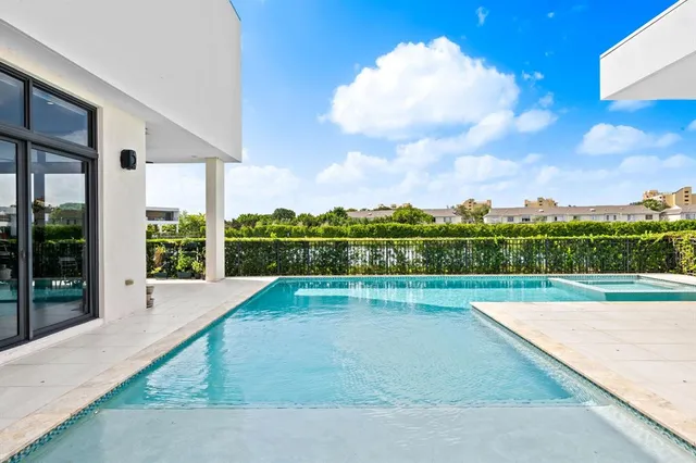 a view of swimming pool with a yard