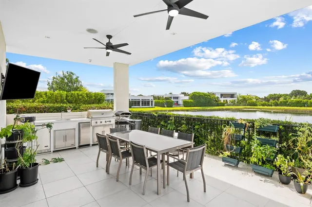 a view of a patio with a table and chairs