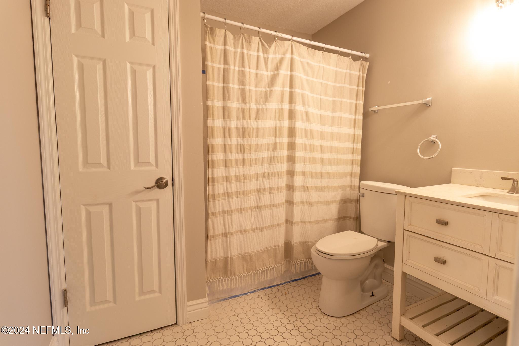 157 Timber Lane Crossing Palatka, FL 32177 - Photo 14 of 16 a bathroom with a sink toilet and shower