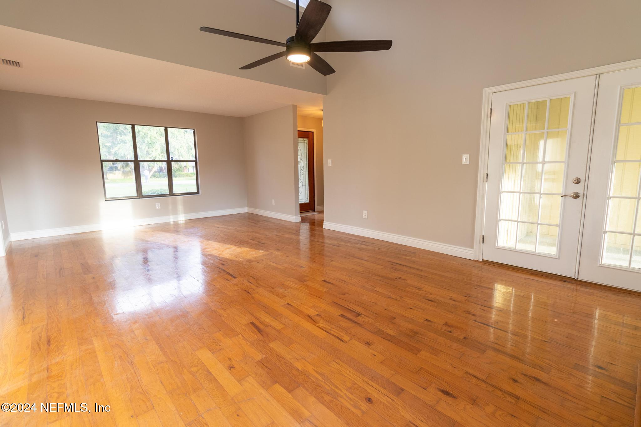 157 Timber Lane Crossing Palatka, FL 32177 - Photo 6 of 16 a view of empty room with wooden floor and fan