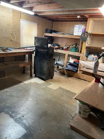 a view of a house with a snow in the yard