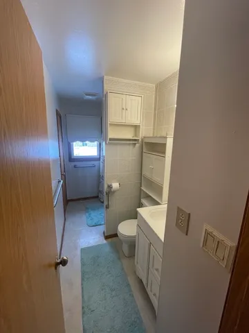 a bathroom with a sink and toilet