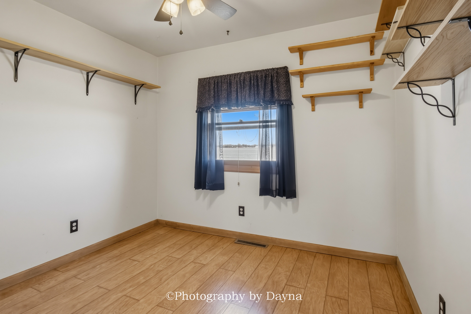 316 South 4000 West Road Kankakee, IL 60901 - Photo 15 of 29 a view of empty room with a fireplace and wooden floor