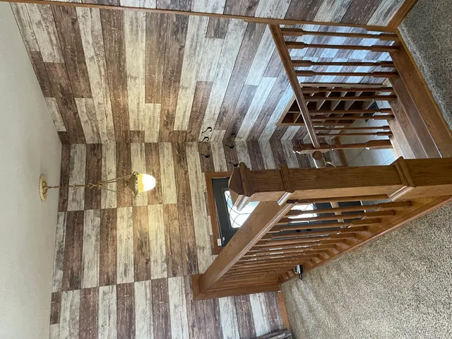 a view of an entryway with a chandelier fan