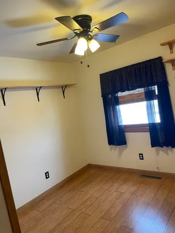 a view of a room with racks on the wall