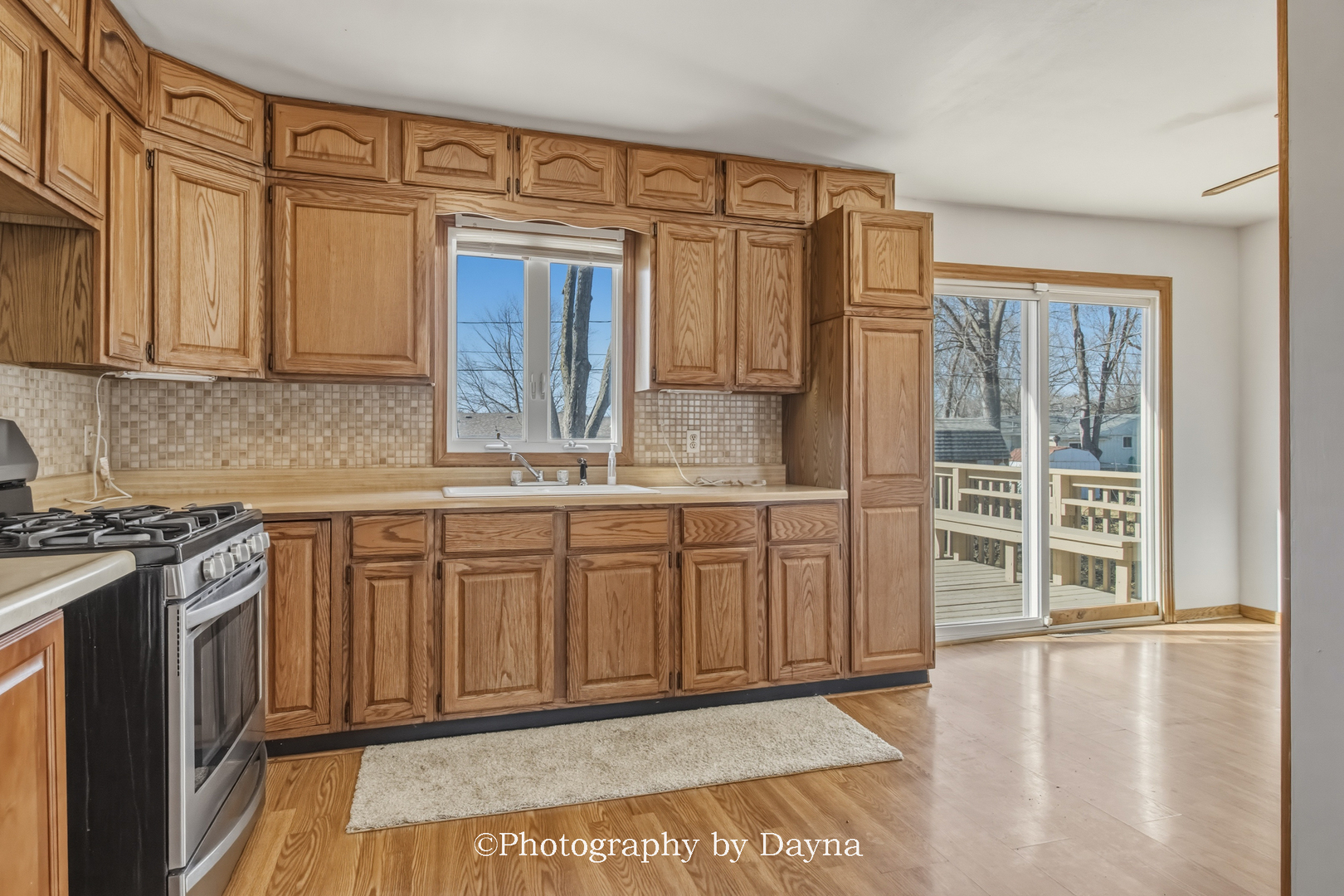 316 South 4000 West Road Kankakee, IL 60901 - Photo 9 of 29 a kitchen with stainless steel appliances granite countertop a stove a sink and a microwave
