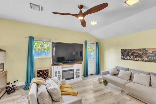 a living room with furniture and a flat screen tv