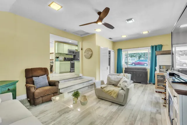 a living room with furniture and a large window