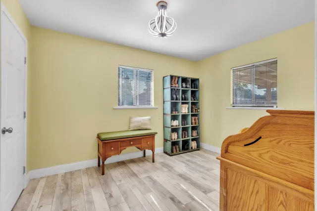 a bedroom with a bed and a book shelf