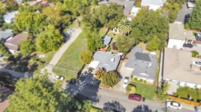 an aerial view of residential houses with outdoor space