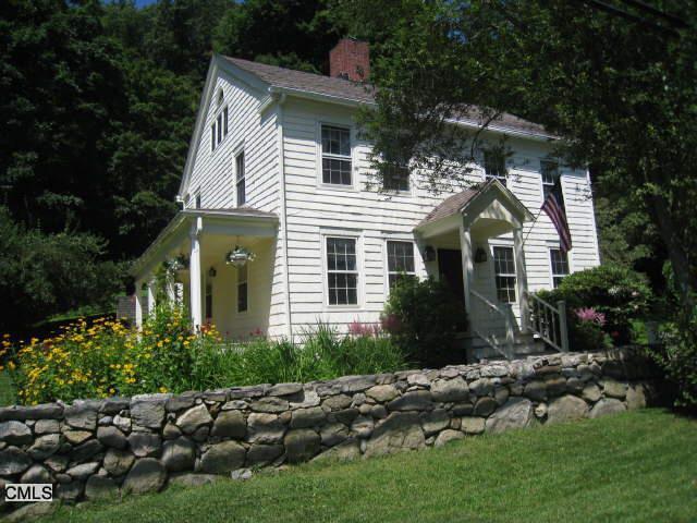 115 North Salem Road Ridgefield, CT 06877 - Photo 1 of 1 a front view of a house with a garden
