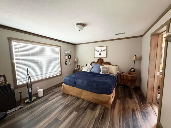 a bathroom with a sink vanity and mirror