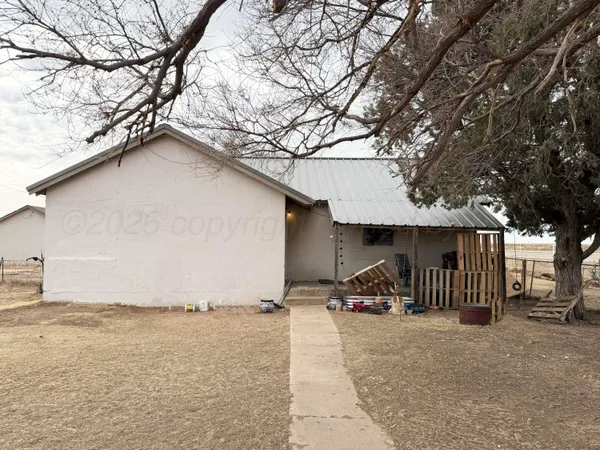 a view of outdoor space with iron fence