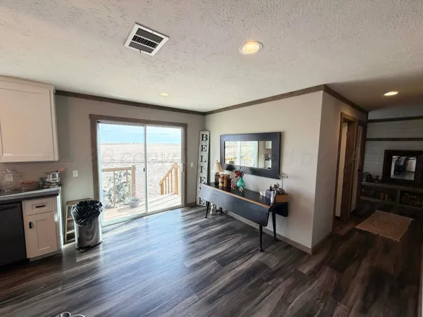 a kitchen with stainless steel appliances granite countertop a stove and cabinets