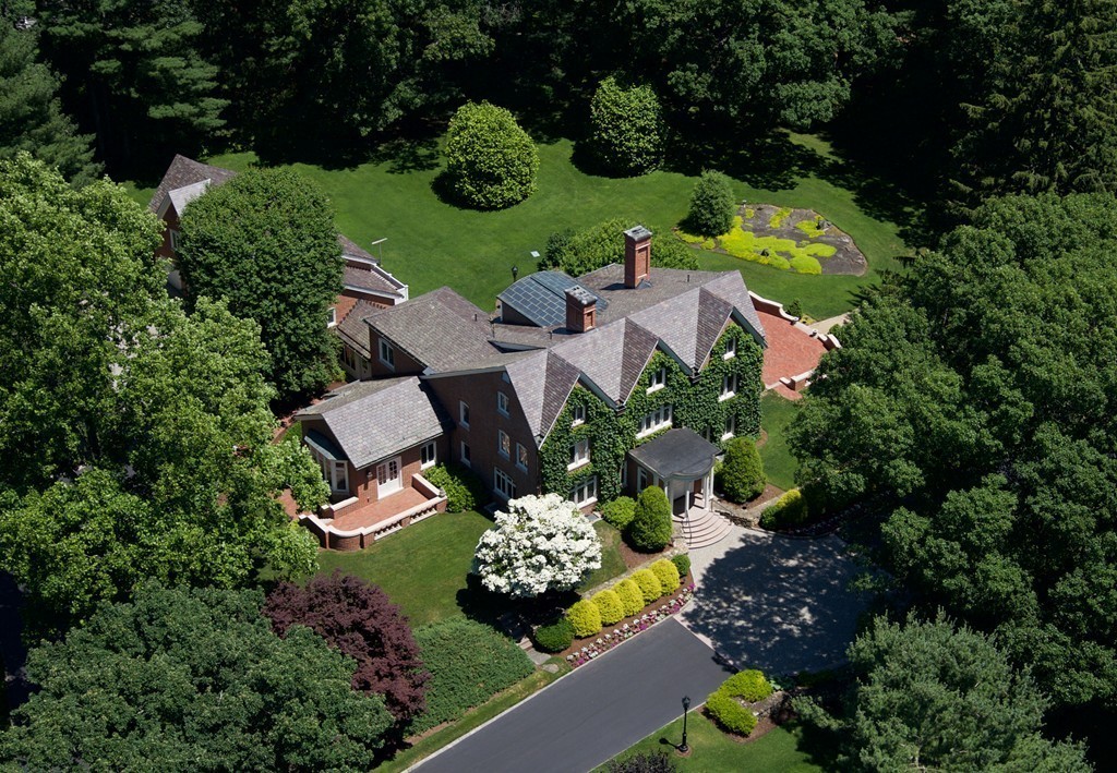 an aerial view of a house with a garden