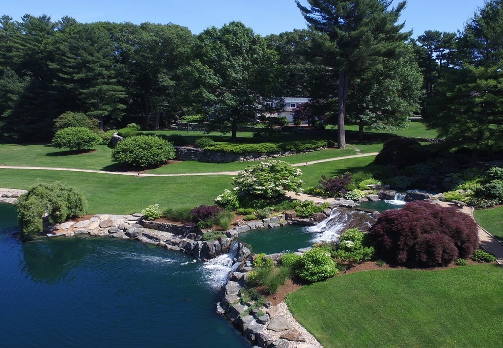 2 Laxfield Road Weston, MA 02493 - Photo 6 of 30 a view of a golf course with a lake