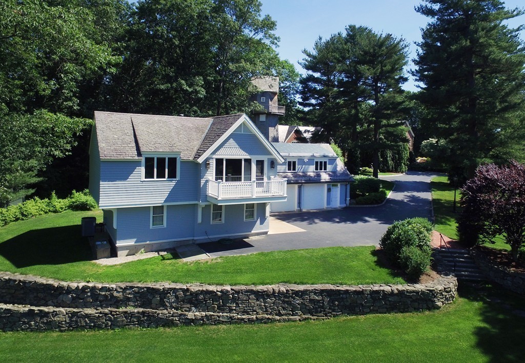 2 Laxfield Road Weston, MA 02493 - Photo 10 of 30 a front view of a house with a garden and plants
