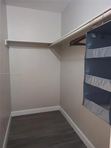 a view of an empty walk in closet