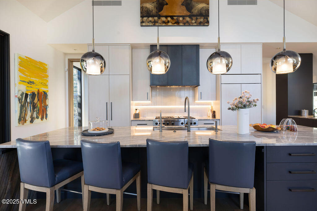 254 Beaver Dam Road Vail, CO 81657 - Photo 12 of 46 a kitchen with a dining table and chairs