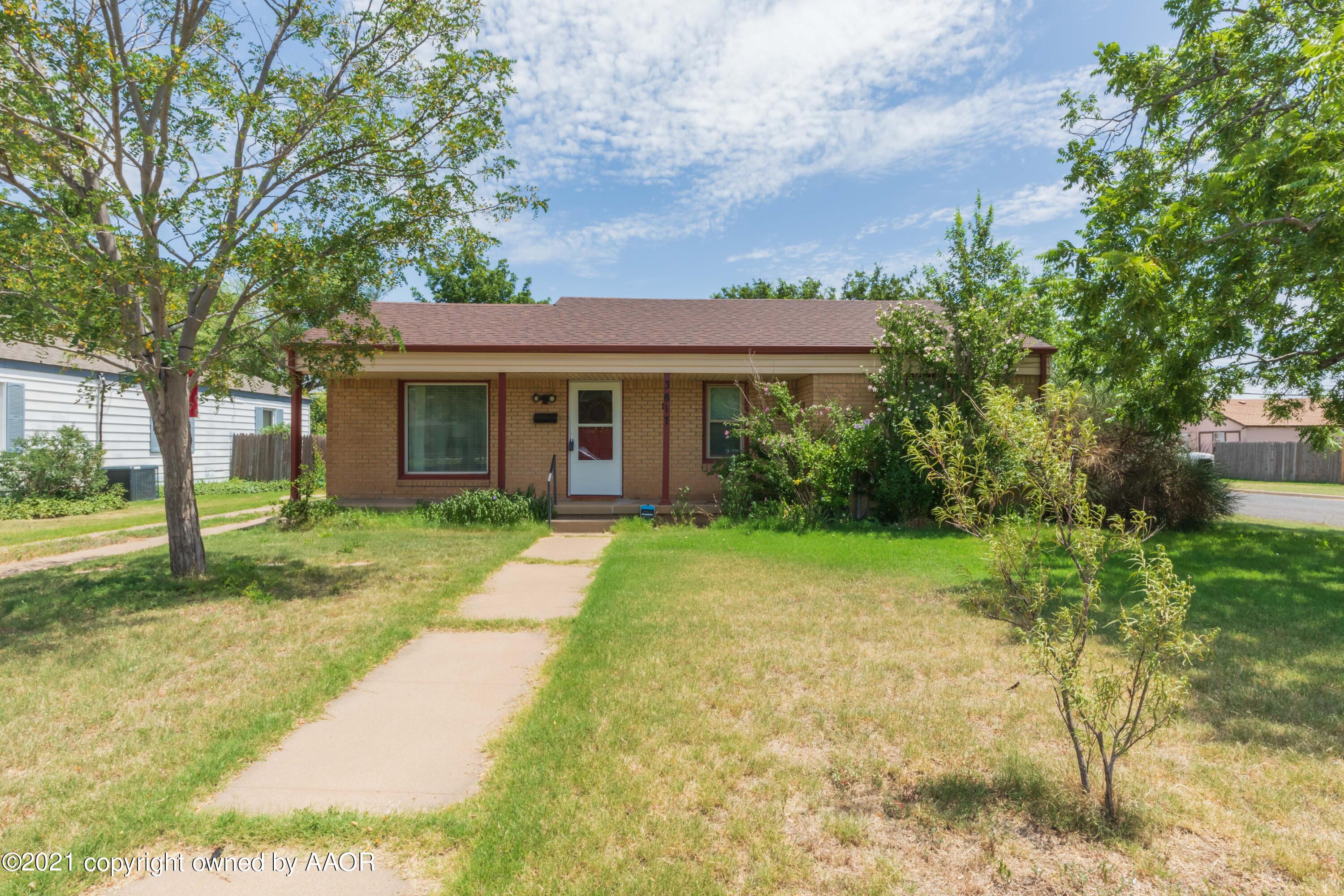 3817 South Hughes Street Amarillo, TX 79110 - Photo 1 of 36 a front view of a house with a yard