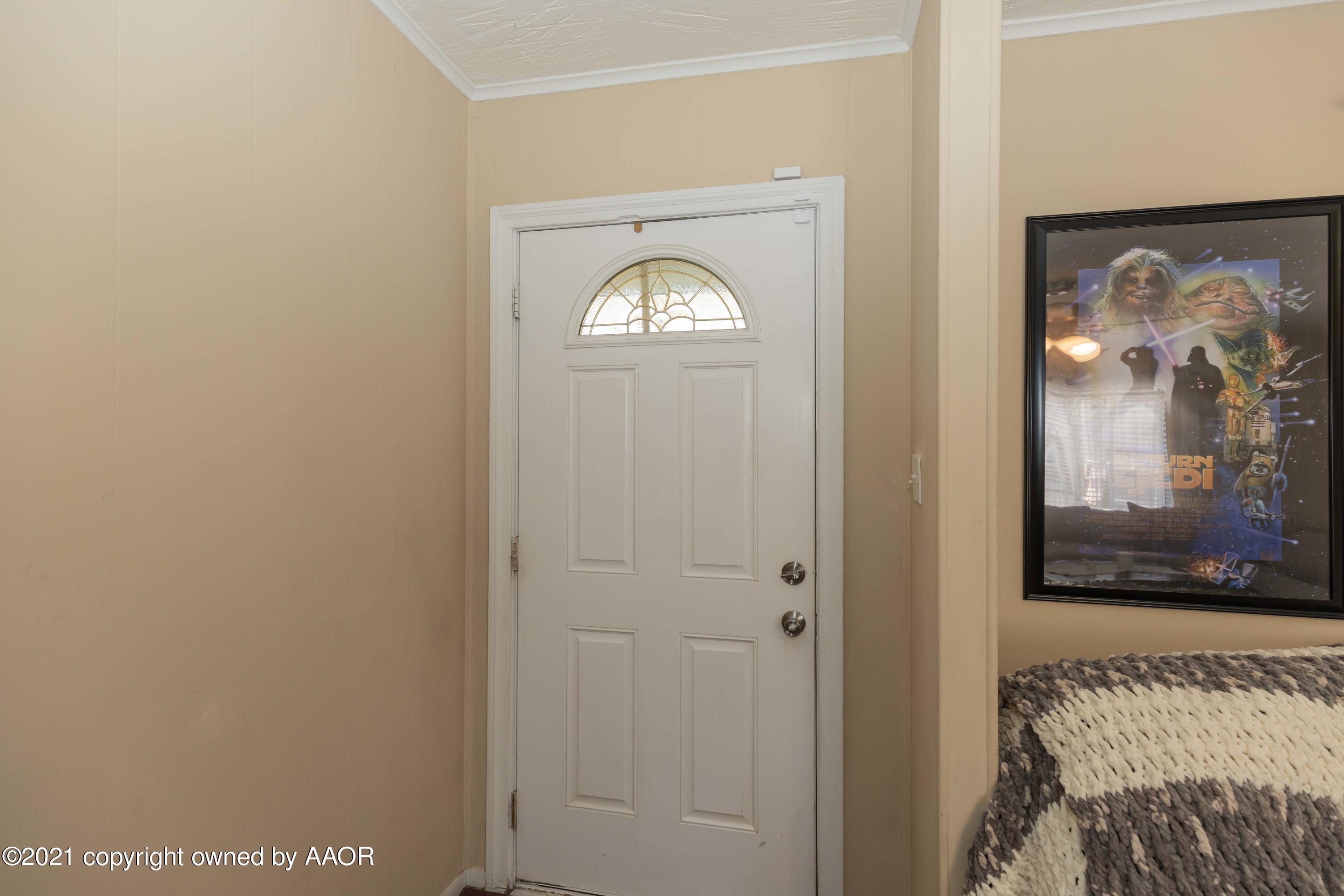 3817 South Hughes Street Amarillo, TX 79110 - Photo 3 of 36 a view of a livingroom with a camera next to a window