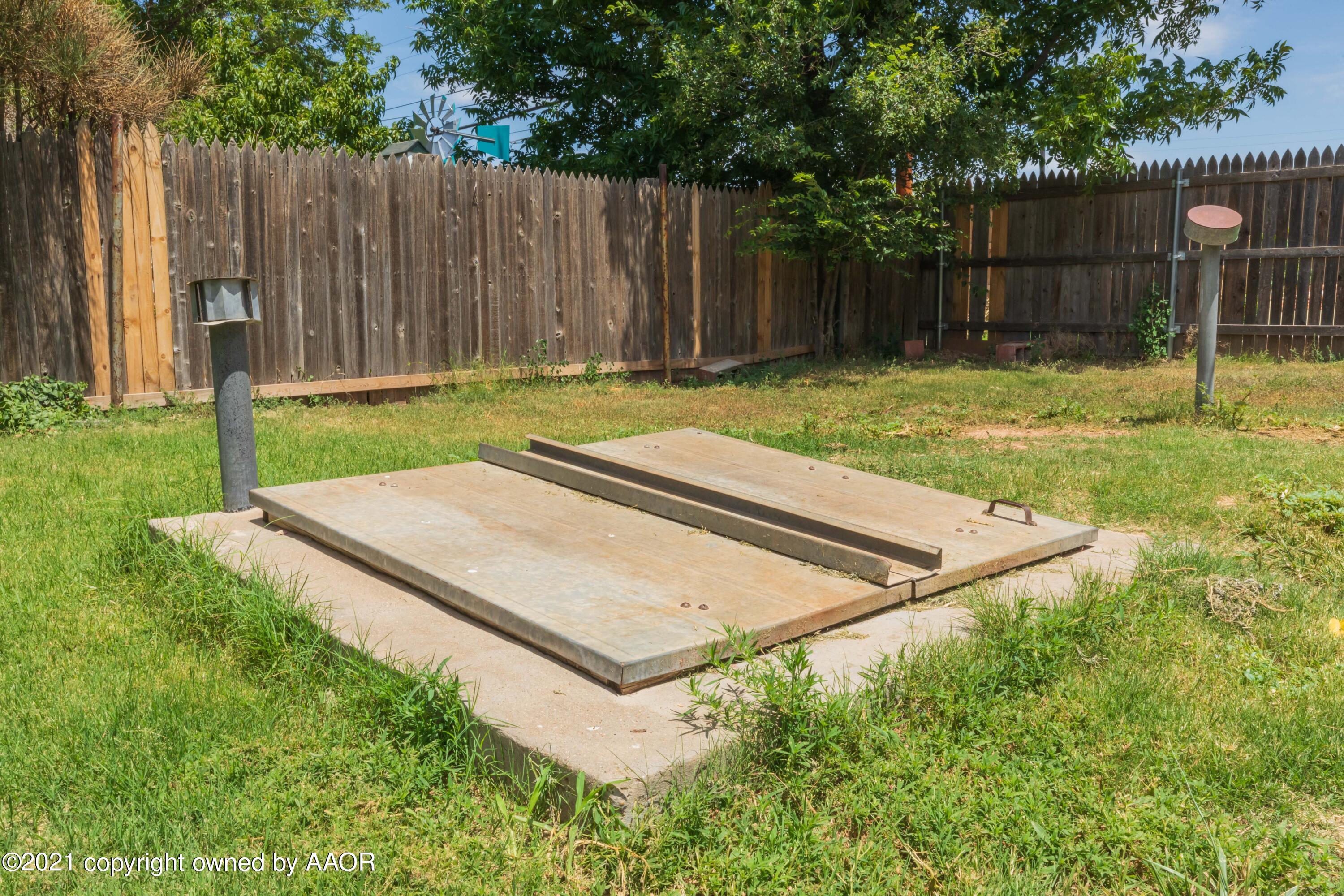 3817 South Hughes Street Amarillo, TX 79110 - Photo 33 of 36 a view of a backyard with wooden fence