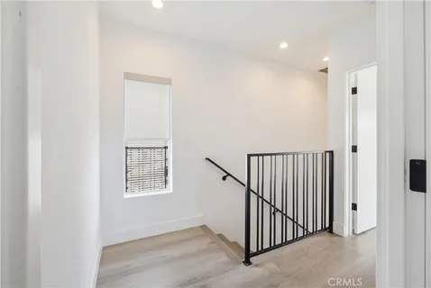 a view of a hallway with windows