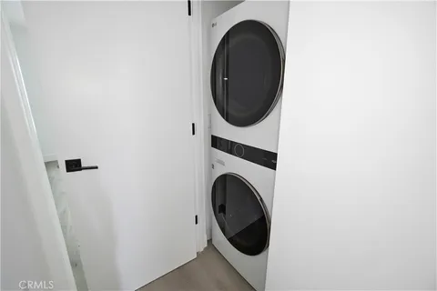 a close view of a utility room with dryer and washer