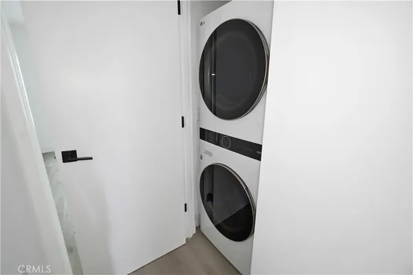a close view of a utility room with dryer and washer