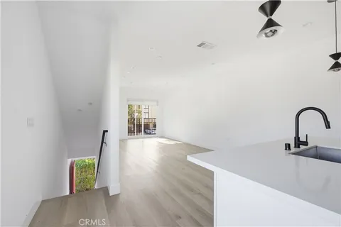 a close view of a sink a faucet and appliance in the kitchen