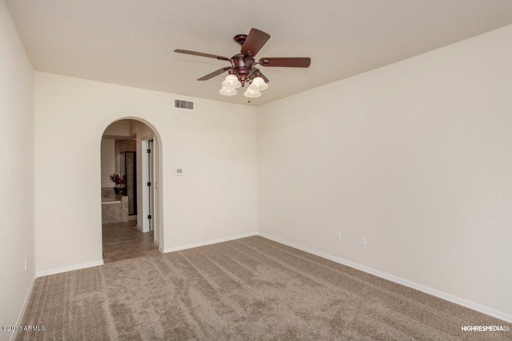 3935 East Rough Rider Road, Unit 1068 Phoenix, AZ 85050 - Photo 12 of 25 Master Bedroom