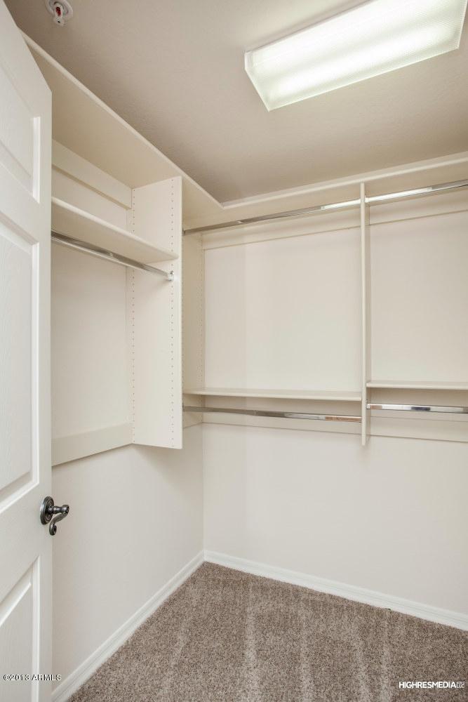 3935 East Rough Rider Road, Unit 1068 Phoenix, AZ 85050 - Photo 16 of 25 Master Walk-In Closet