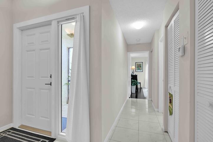 18619 Breezy Palm Way Boca Raton, FL 33496 - Photo 24 of 41 V29 Hallway to BR 2 Section