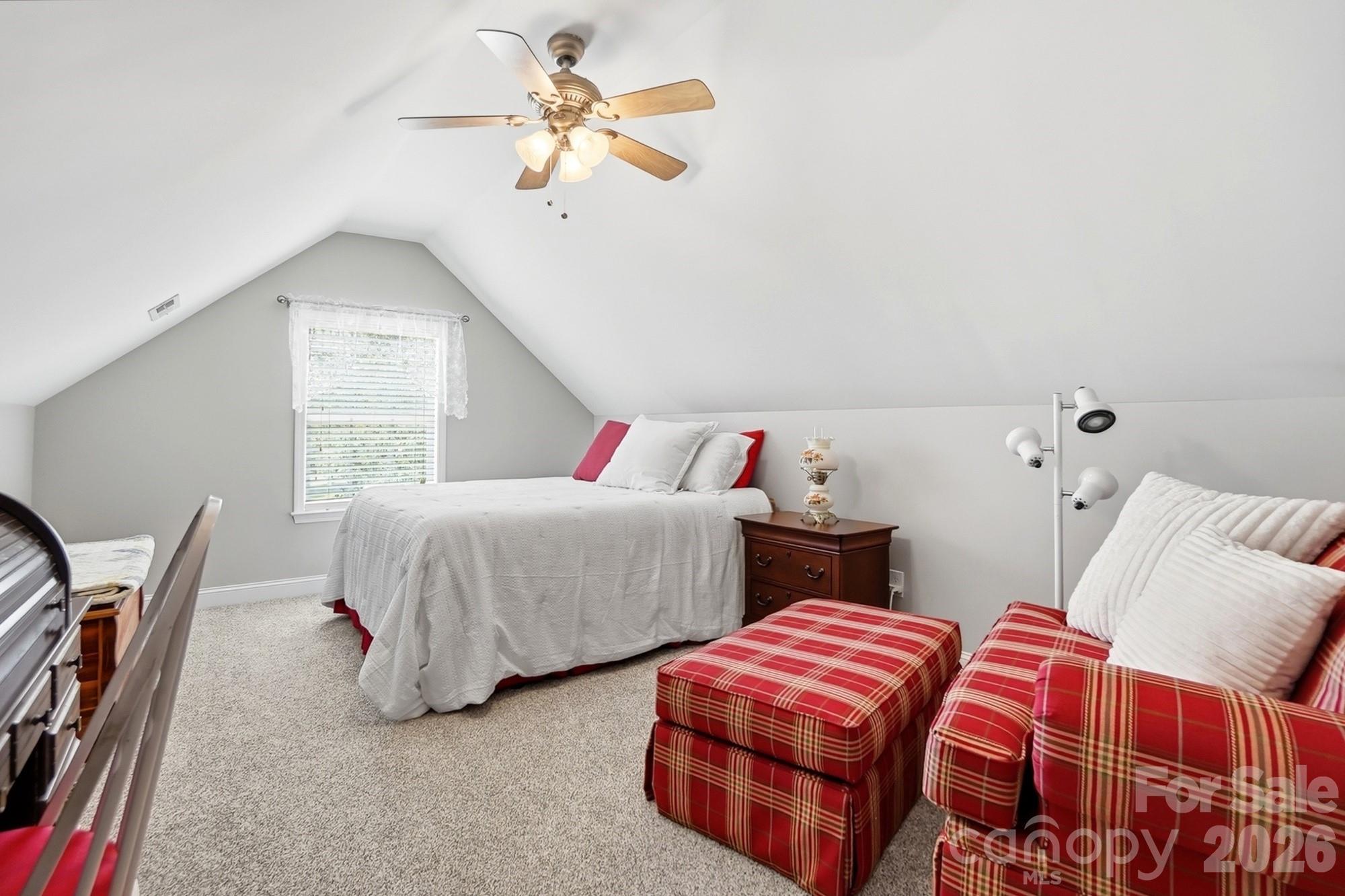 3324 Muddy Creek Road Midland, NC 28107 - Photo 39 of 46 a bedroom with two beds and a chandelier